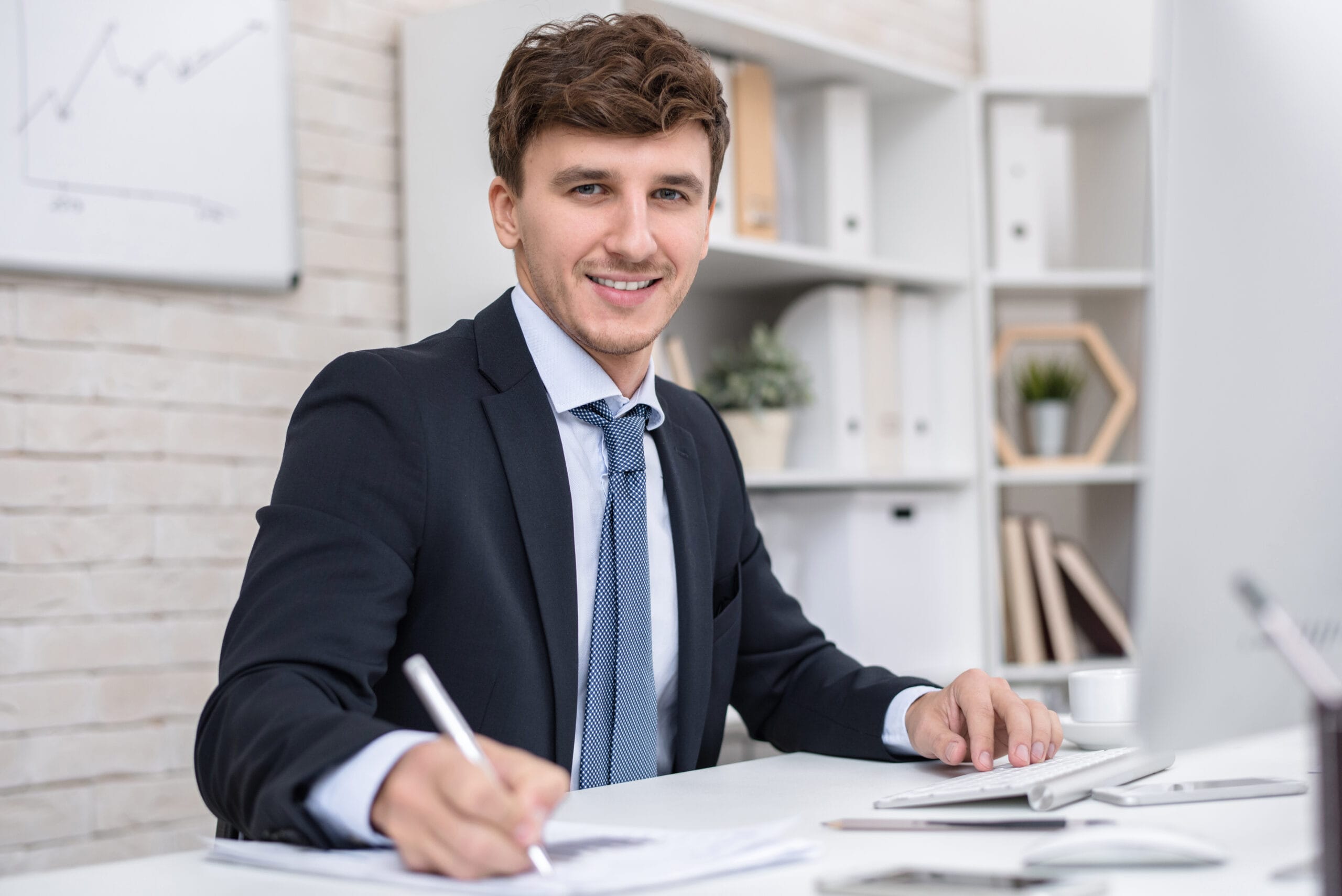 Bluline Chartered Business Accountants - Tax Returns - tax Practitioner at desk